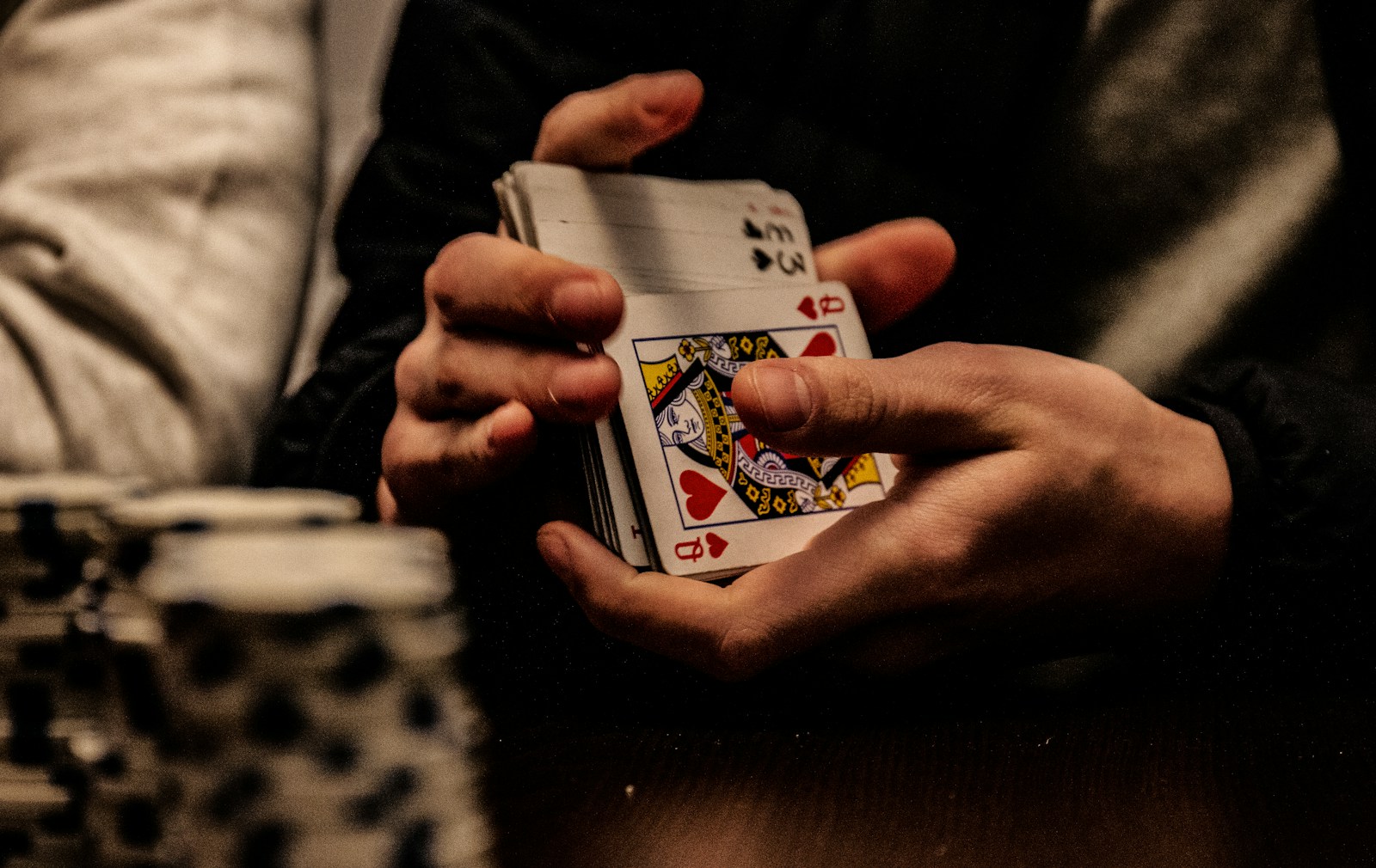 person holding king of spade playing card